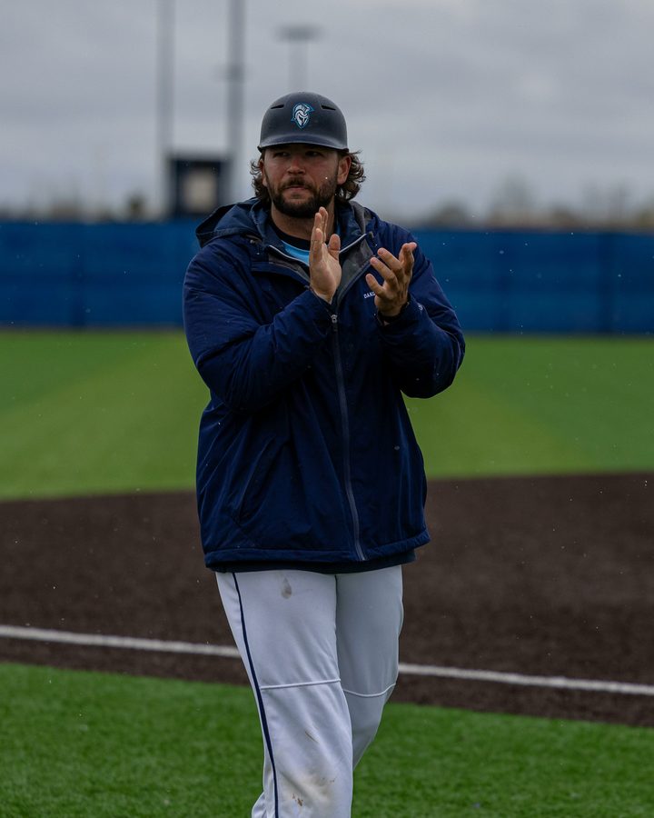 Quentin Evers on the field in a navy team jacket